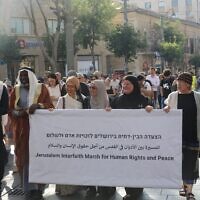 Religious leaders head an interfaith march in support of peace and human rights down Jaffa Street in Jerusalem on June 3, 2024. (Jacob Lazarus/Rabbis for Human Rights)