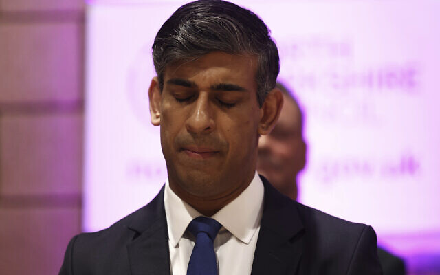 Britain's outgoing Prime Minister Rishi Sunak closes his eyes as he waits for the declaration of results for  his seat in the general election at the Richmond and Northallerton count center in Northallerton, England, July 5, 2024. (Darren Staples, Pool via AP)
