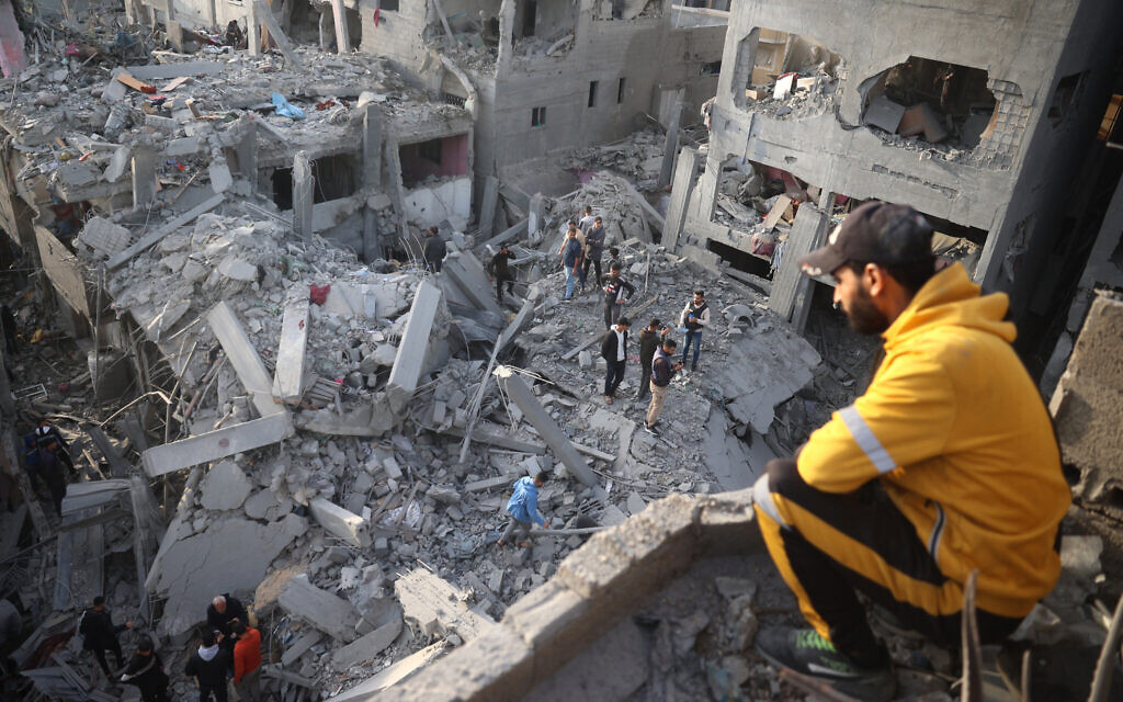 Palestinians inspect the damage after an Israeli strike on the Nuseirat refugee Camp in the central Gaza Strip on December 7, 2024. (Eyad BABA / AFP)